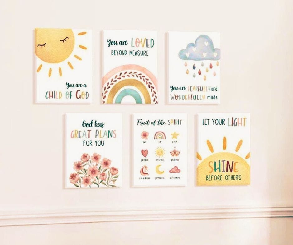 6 pictures demonstrating Christian wall art for a newborn's room. There is a picture of a sun with the words You are a Child of God. A picture of flowers with the words God has Great Plans for you. And 4 other pictures of this type. They are displayed on a wall - 3 on the top and 3 on the bottom. Used to illustrate the blog post What does a first-time grandma need?