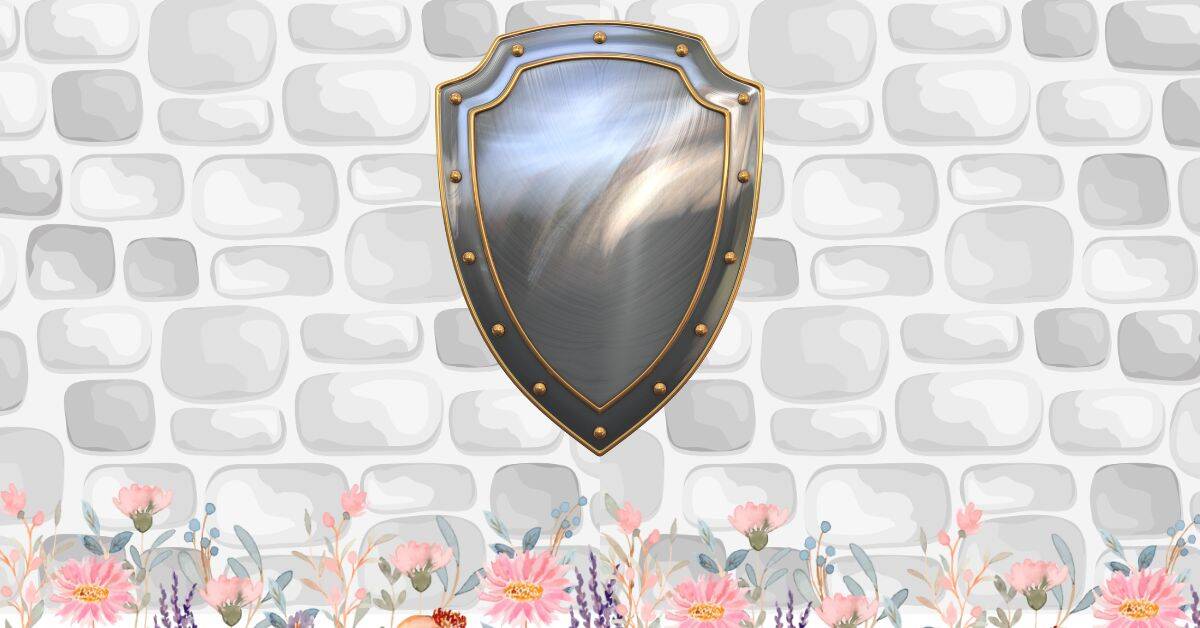 Feature image for the Psalm 91 prayer cards post. It shows a brick wall with a flower border along the bottom. On the wall in a silver metal shield with gold rivets.