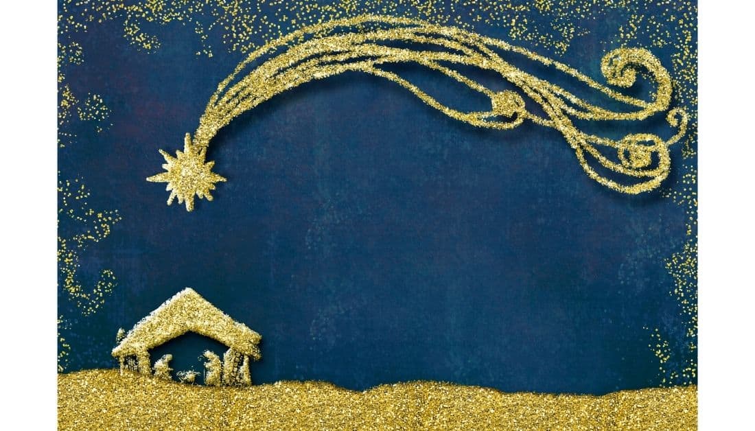 Featured image for the post, inspiring Christmas quotes. The background is dark blue and there is a nativity scene done in sandpainting. The sky has a sand painted star on the left side with a tail that trails over the whole top of the picture. The borders of the picture are also sand, in lesser amounts.