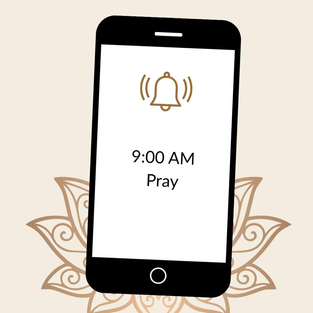 A drawing of a cell phone with an alarm bell on it. The message on the phone says 9:00 AM Pray. This is used to illustrate the idea of Time Blocking as a way to develop your prayer life.